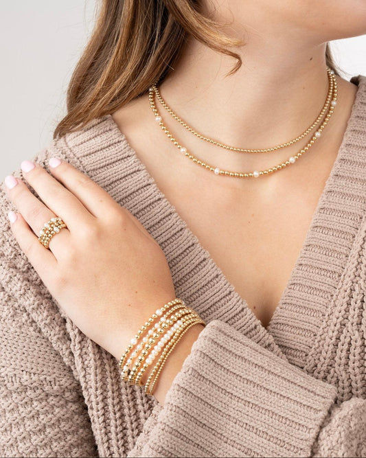 model with gold filled necklaces, bracelets and rings with pearls