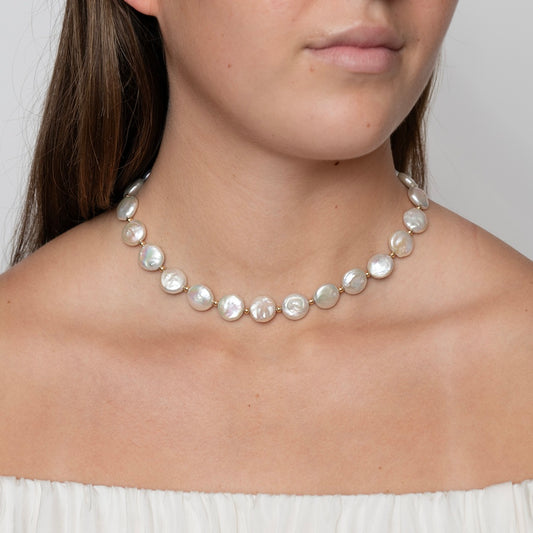 Model wearing a coin pearl necklace