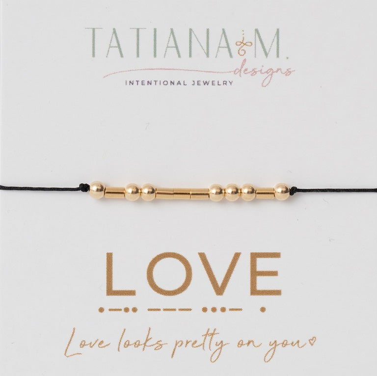 Black string bracelet with gold filled beads on LOVE card