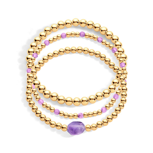 A stack of three gold-filled bracelets featuring purple amethyst beads and gold-filled beads, designed for everyday wear.