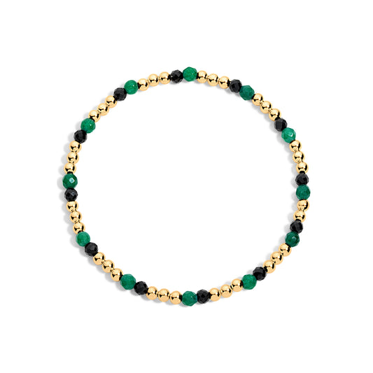 A bracelet with a mix of 14K gold-filled beads and multicolored vibrant crystals, displayed against a white background.