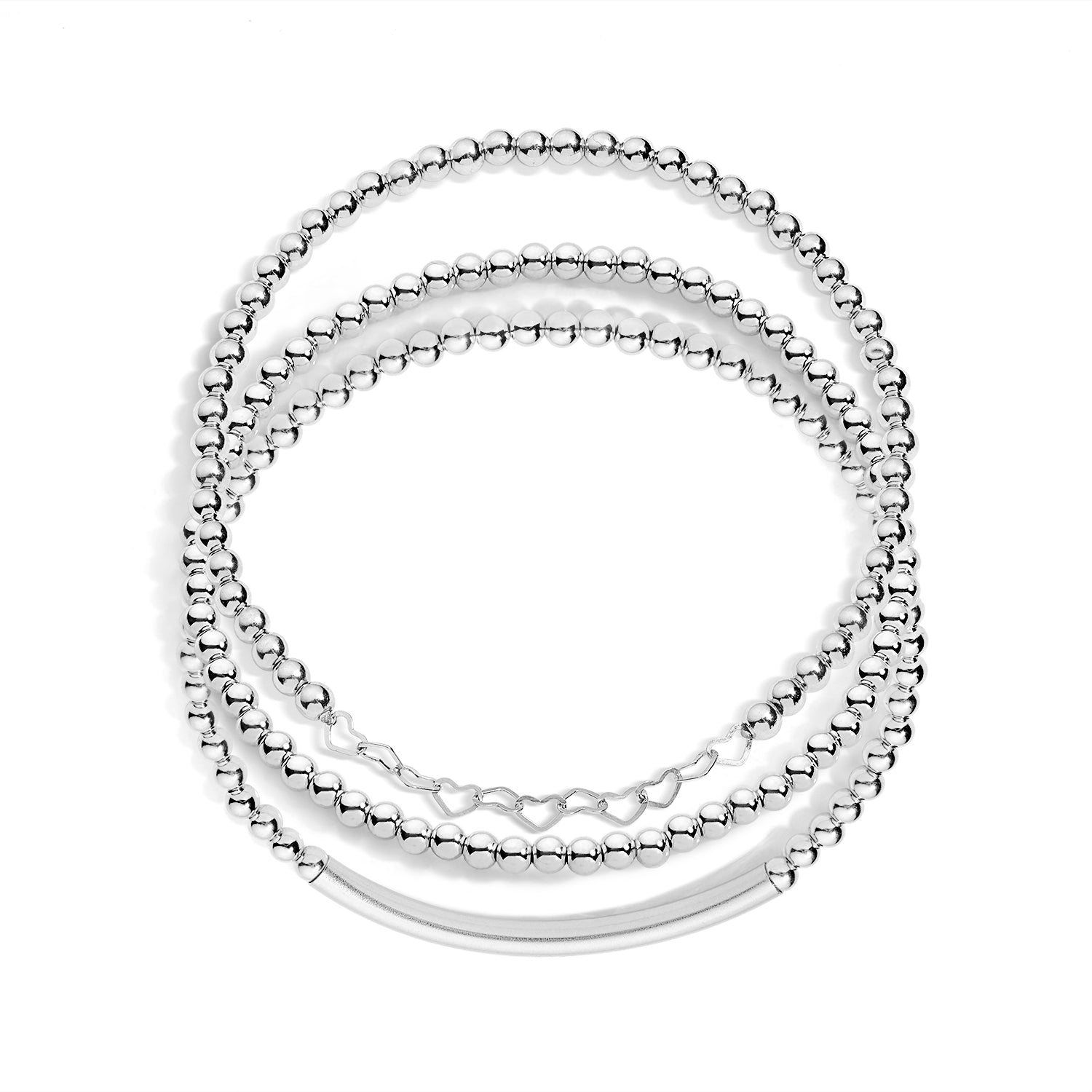 A set of three silver-colored bracelets designed for layering, featuring different styles including a bar accent, beaded chain, and a stretch bracelet.