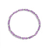 A sterling silver bracelet with purple gemstone beads and silver accents, displayed against a white background.