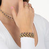 Model wearing gold-filled gemstone bracelets and rings