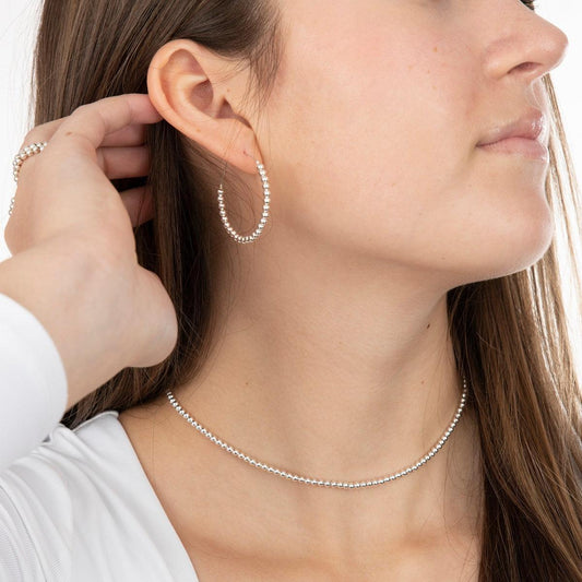model wearing sterling silver 3mm beaded necklace