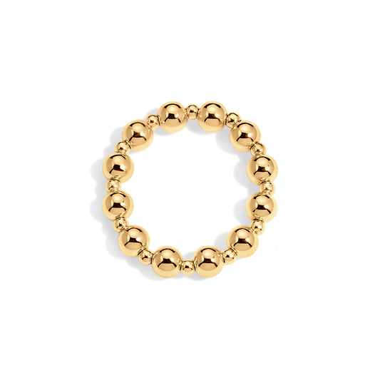 Gold beaded ring on a white background