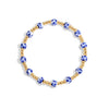 Bracelet with blue and gold beads on a white background