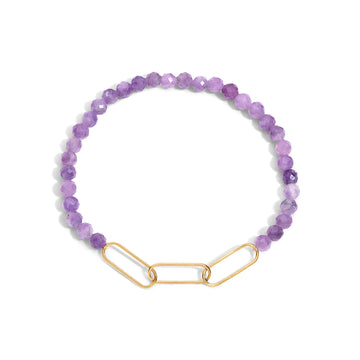 A bracelet with purple gemstone beads and a gold-filled paperclip accent.