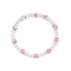 Pearl bracelet with pink gemstones on a white background