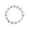 Bracelet with blue floral beads and gold accents on a white background