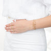 Model wearing gold filled beaded bracelets and rings with herkimer diamonds