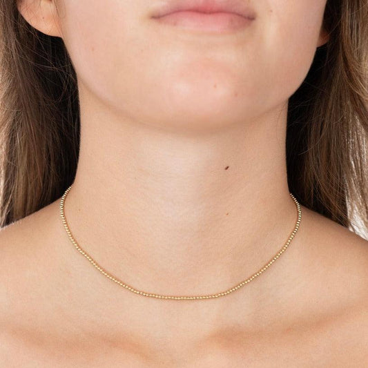 model wearing a 2mm gold-filled beaded necklace