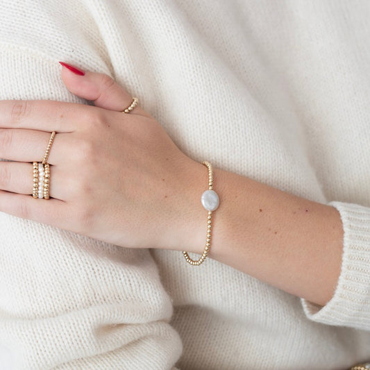 Model wearing gold-filled and pearl bracelet