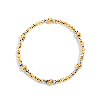 Gold and silver beaded bracelet on a white background