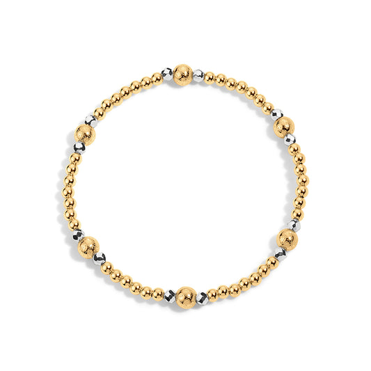 Gold and silver beaded bracelet on a white background