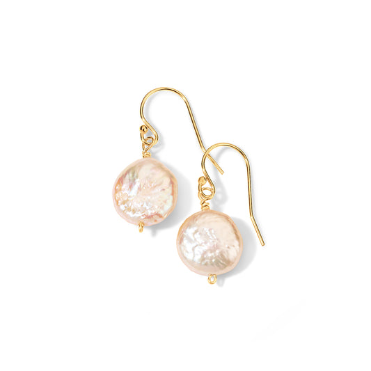 A pair of gold-tone fishhook drop earrings with irregular, lustrous pale pink baroque pearls, shown on a clean white background.