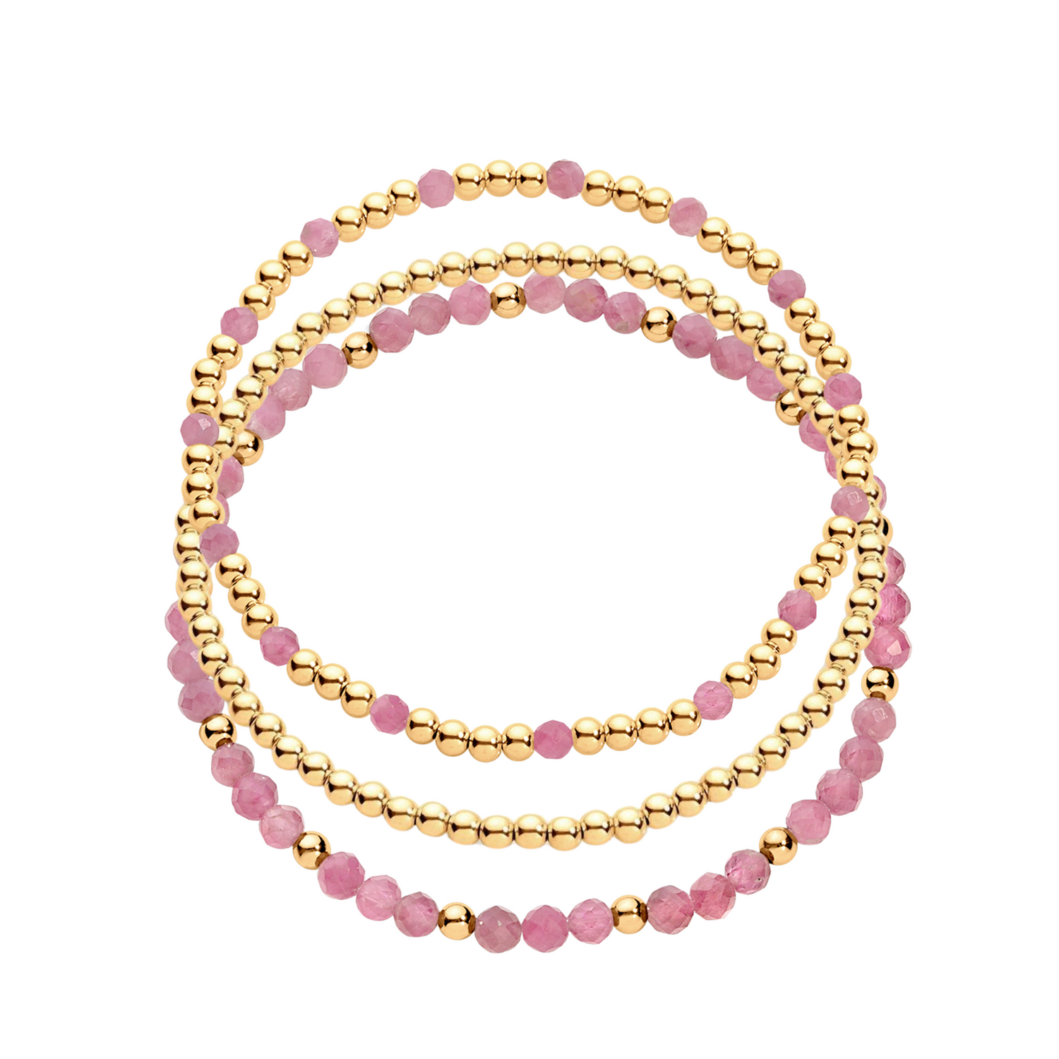 A stack of three bracelets, one featuring gold-filled beads and another with gold-filled beads and pink gemstones.