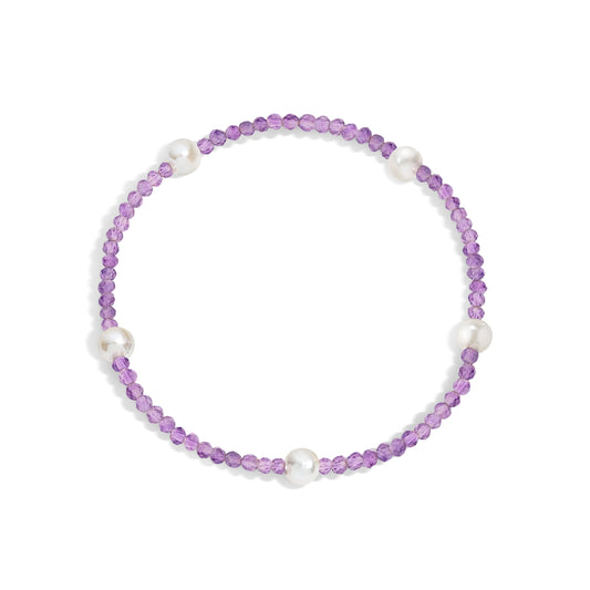 A bracelet with amethyst gemstones and white pearls, displayed on a white background.