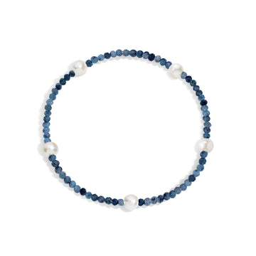 A bracelet with blue gemstones and white pearls, displayed on a white background.