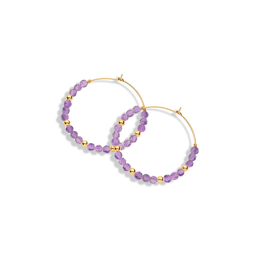 A pair of gold-filled hoop earrings with amethyst gemstones and gold beads