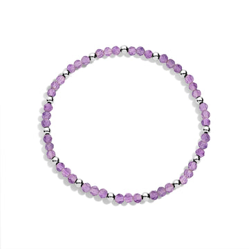 A sterling silver bracelet with purple gemstone beads and silver accents, displayed against a white background.