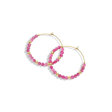 A pair of gold-filled hoop earrings with pink gemstones and gold beads