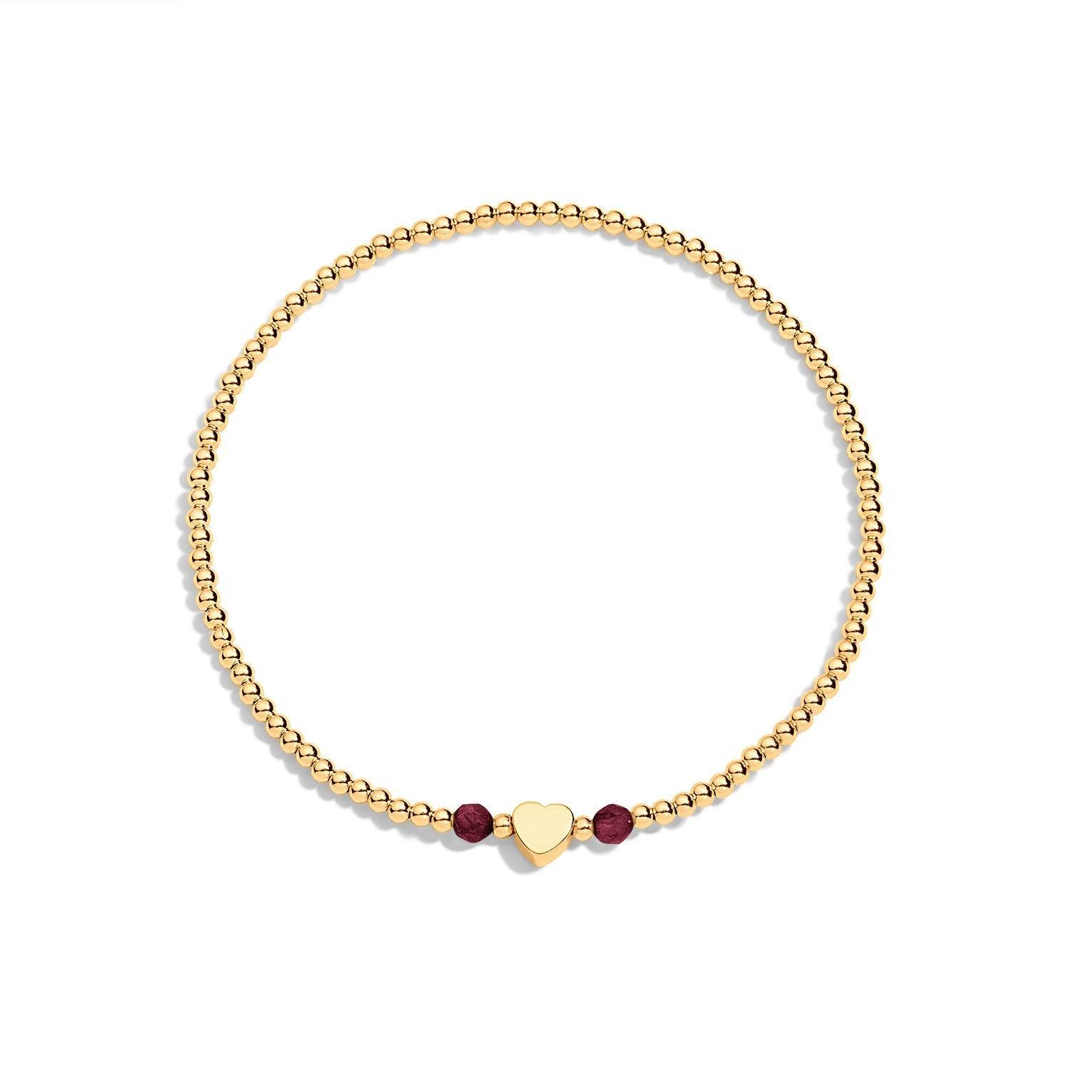 Gold filled bracelet with 2 dark red gemstones