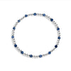 A sterling silver bracelet with blue gemstones, featuring a stretch design for flexibility.