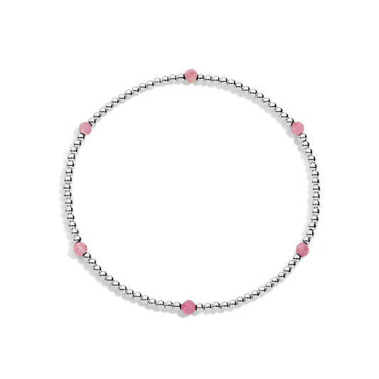 A sterling silver bracelet with pink gemstone accents on a white background.