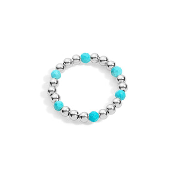 A sterling silver ring with turquoise gemstone accents, featuring a stretchable design with silver beads and purple stones evenly spaced around the band.