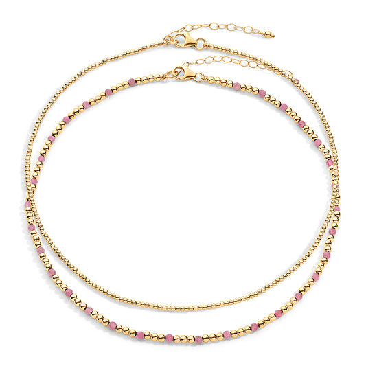 Two-layered gold-colored necklace with pink semi-precious gemstones and 14k gold-filled beads, displayed against a white background.