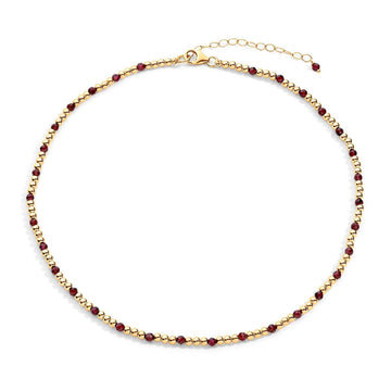  gold-filled chain necklace with ruby semi-precious gemstone accents, displayed against a white background.