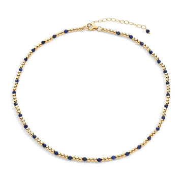  gold-filled chain necklace with blue  semi-precious gemstone accents, displayed against a white background.